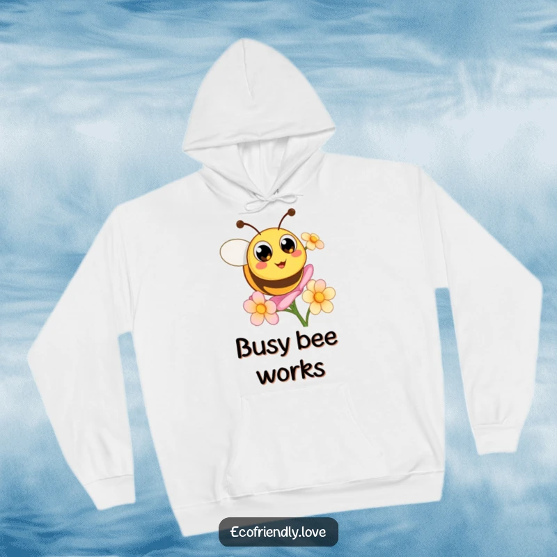 Funny hoodie shows a cute, round bee with big, happy eyes buzzing enthusiastically around a blooming flower.