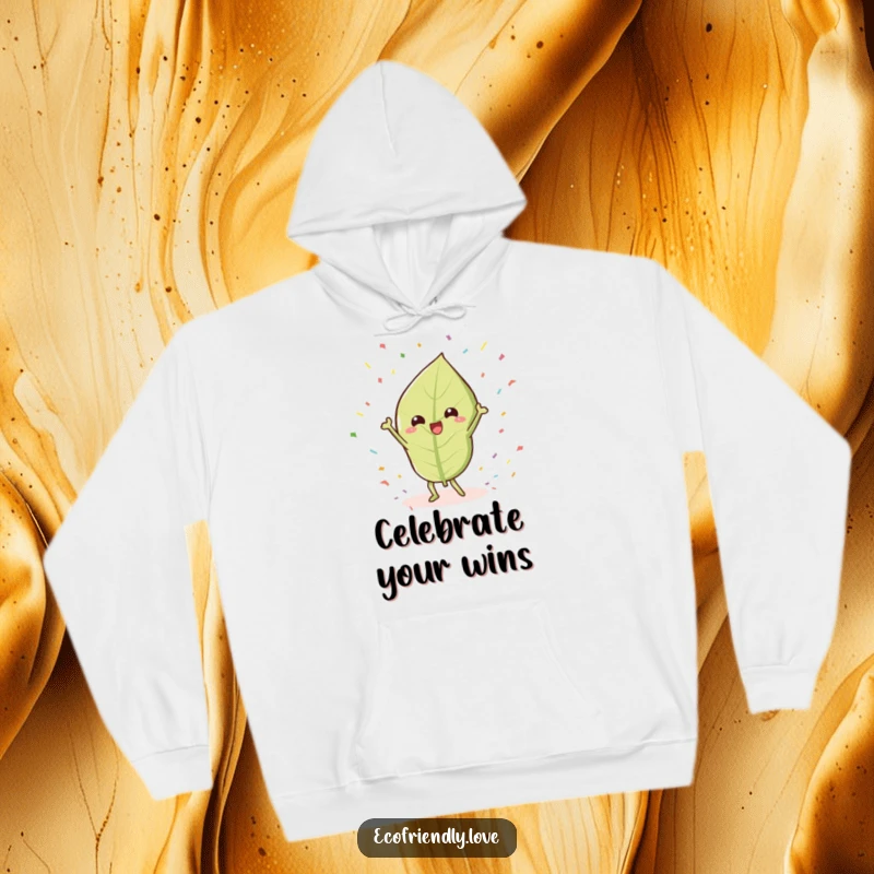 Funny Leaf Hoodie: A kawaii leaf character humorously doing a victory dance surrounded by confetti, perfect for cozy celebration.