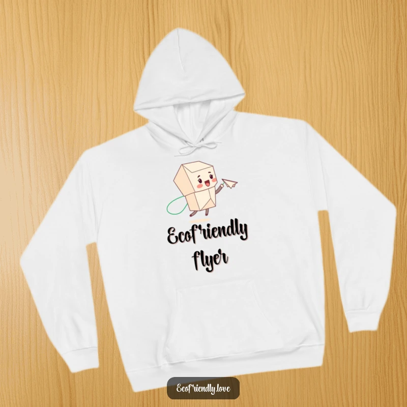 Funny recycled paper character throwing a paper airplane with a green trail, featured on a cozy hoodie, spreading eco-friendly joy.