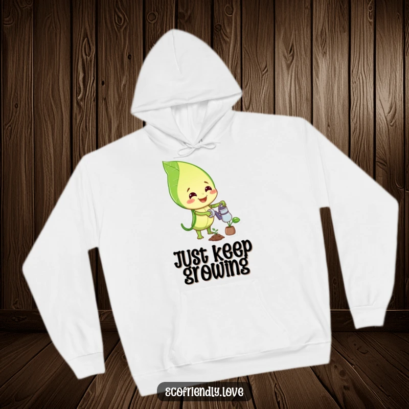 Funny hoodie with a happy smiling leaf character watering a small plant, ideal for cozy relaxation and garden lovers.
