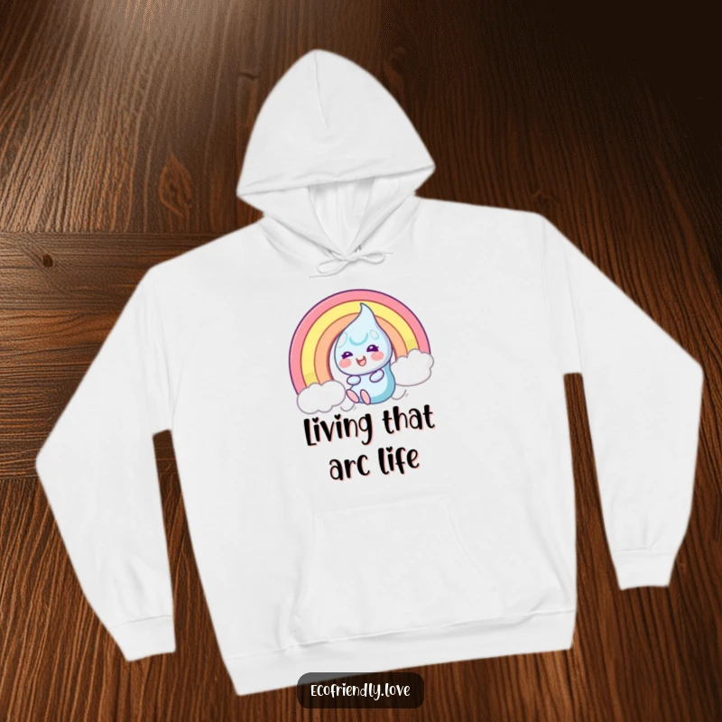 Funny Hoodie showcasing a beaming dewdrop character in mid-slide down a colorful rainbow, symbolizing carefree fun and happiness.
