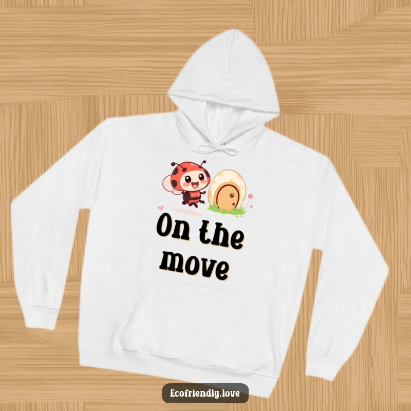 Funny hoodie design of an excited ladybug character zooming at high speed past a friendly, smiling mushroom house.