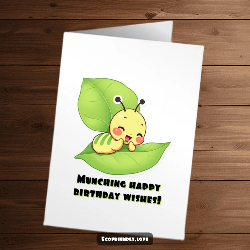 Funny Free Printable Birthday Card featuring a giddy caterpillar character happily munching on a large, green leaf with delight.