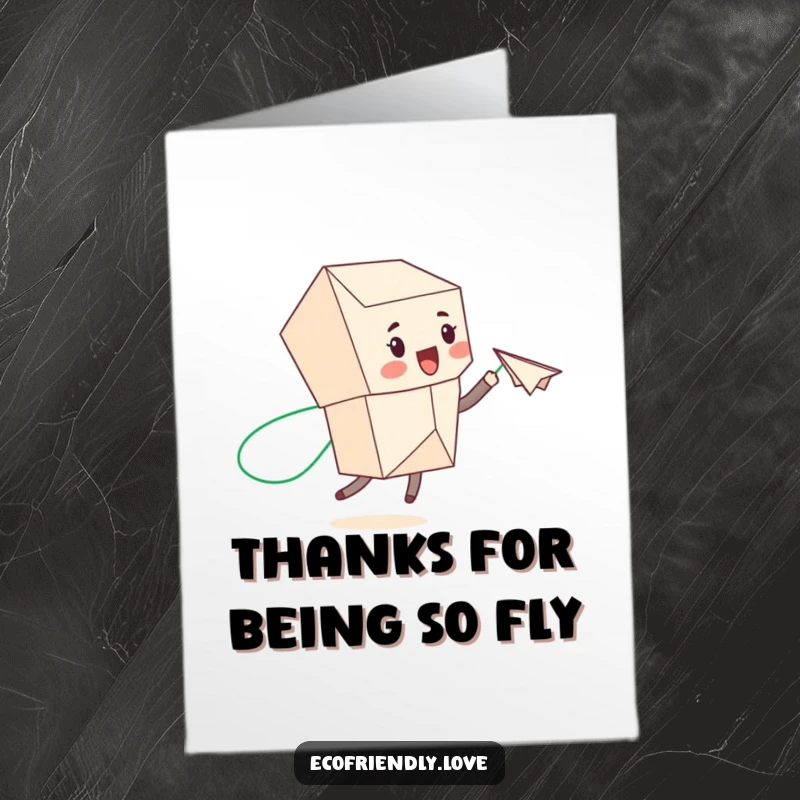 Funny Free Printable Thank You Card: Cute recycled paper character launches a paper airplane, leaving a green trail of thanks.