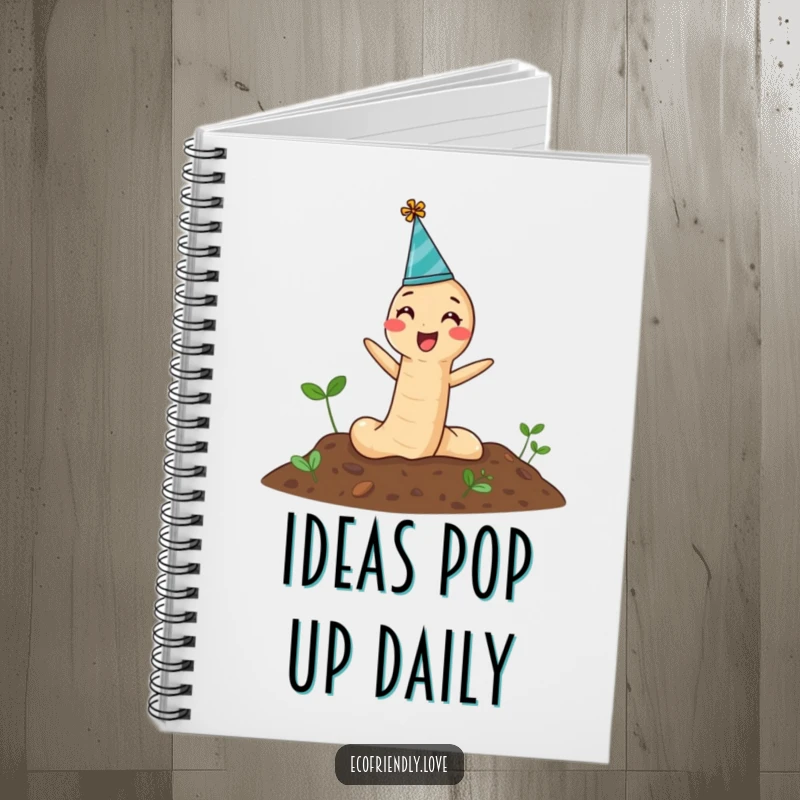 Funny Notebook featuring a joyful earthworm in a party hat emerging from soil, perfect for jotting down cheerful plans.
