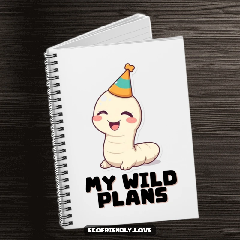 Funny kawaii worm giggling with a party hat on a notebook, a humorous tool for capturing fun thoughts.
