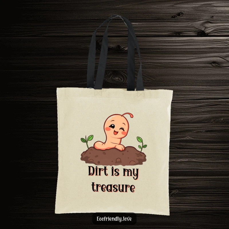 Funny tote bag with a happy earthworm peeking out from soil, giggling with delight, perfect for carrying gardening tools.