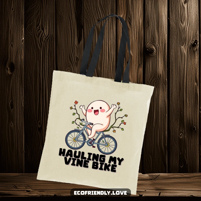 Funny tote bag depicting a happy blob character riding a vine bicycle, a practical and humorous accessory.
