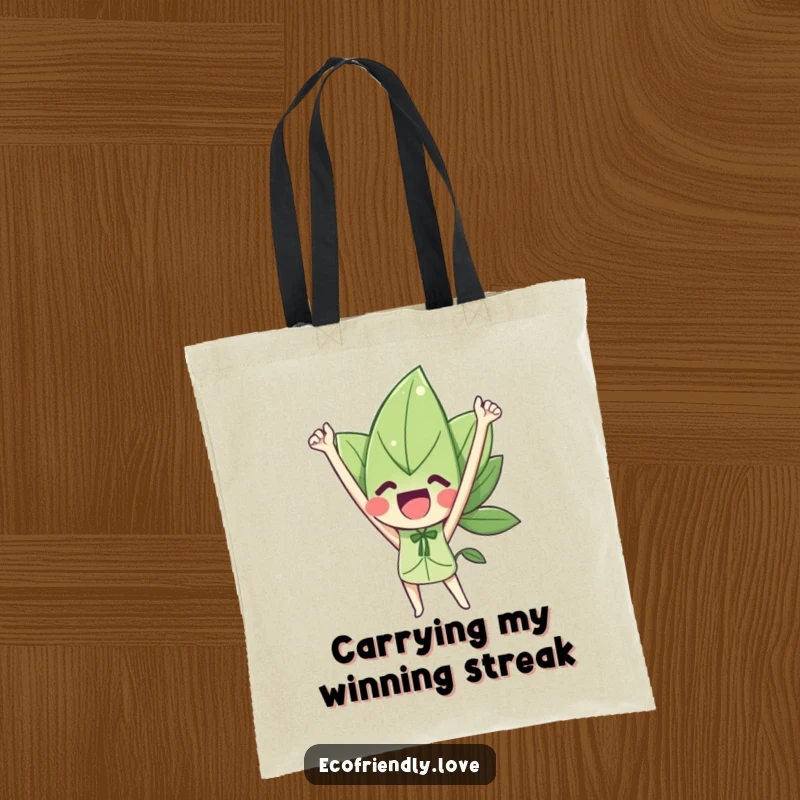 Funny tote bag depicting a happy leaf character with arms raised in a gesture of victory, ideal for achievers.