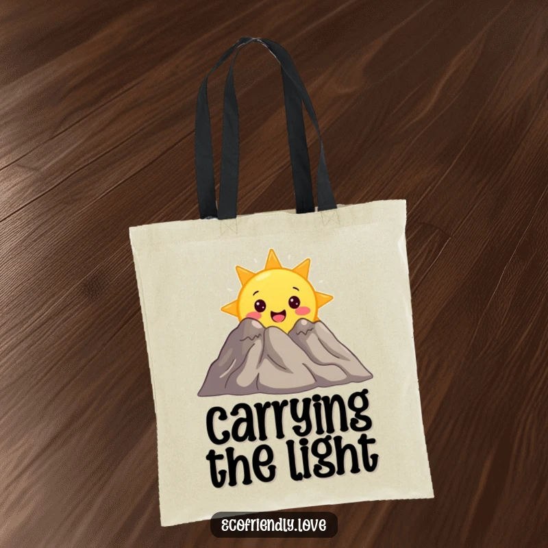 Funny tote bag featuring a surprised sun character peeking from behind a smiling mountain, perfect for adventurers and sun lovers.